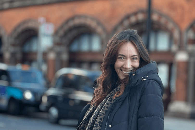 Image: Photo of Kayleigh Vermont looking at the camera with a blurred street view behind